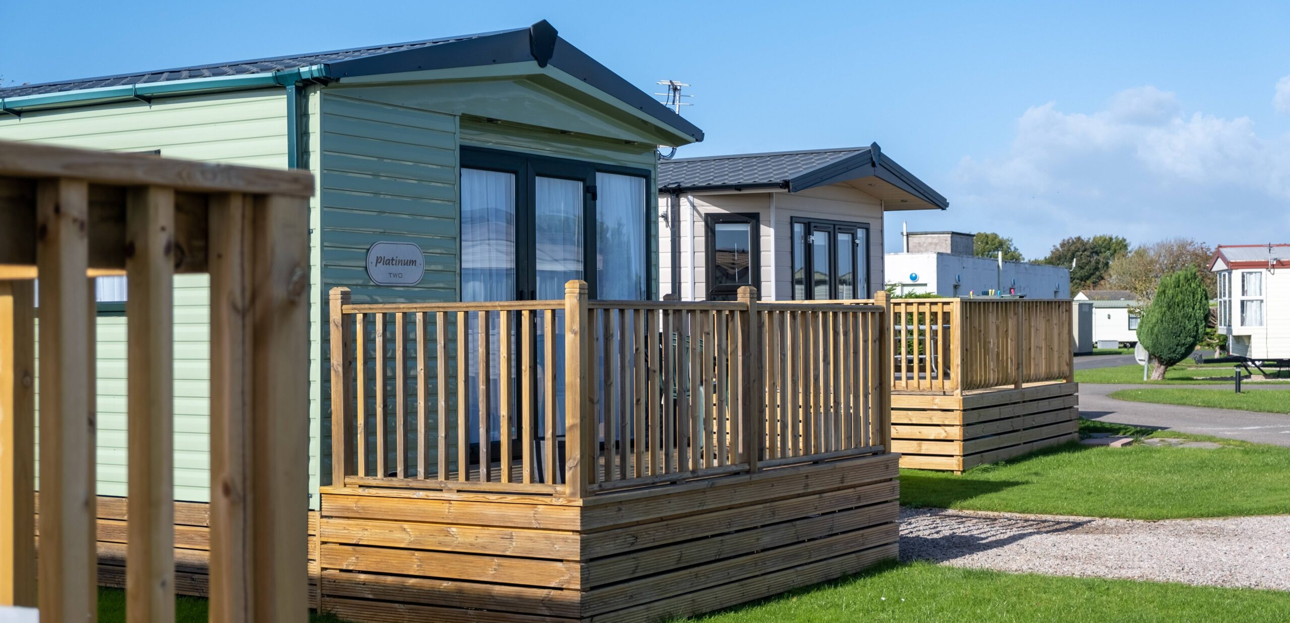 Close up shot of two caravans located in Seacote Park, both complimented by spacious balconies